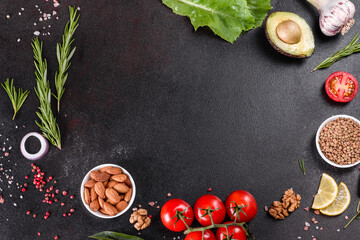 Composition of spices and herbs on a dark concrete background