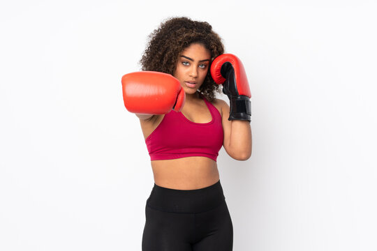 Young African American sport woman isolated on white background with boxing gloves