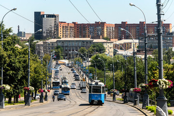 Aerial view of Soborna Street and bridge over Southern Bug river with public transport in Vinnytsia, Ukraine. July 2020