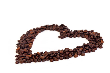 A heart made of coffee beans, isolated on a white background.