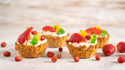 Oatmeal cooked baskets with cottage cheese and fruits. Healthy breakfast oatmeal cups. Romantic food. Cook at home