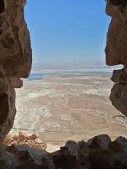 view of the dead sea from a hole in the Masada ruins