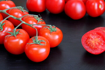 Vegetables on the table, frame of vegetables, radishes, cucumbers, tomatoes, garlic, black background.