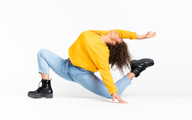 Young African American woman dancing over isolated white background