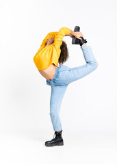 Young African American woman dancing over isolated white background