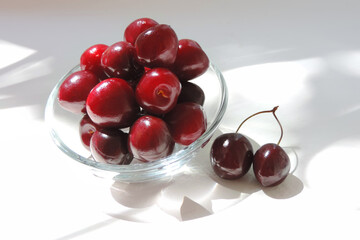      Raw fresh cherries in a glass bowl    
