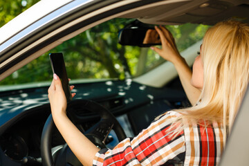 Young woman driving her car