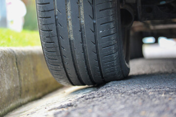 Car wheel on the edge of the road