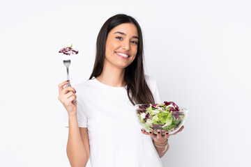 Young woman with salad isolated on white background