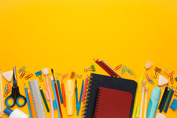 Back to school, items on yellow background. Welcome to learning. Sale accessories for knowledge, retail. Study shopping. Copy space for text.