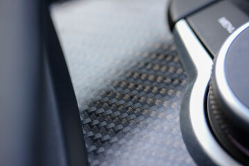 Close up of carbon fiber trim on vehicle dashboard