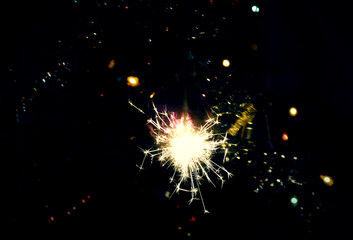 Obraz premium Bengali fire. Festive firework salute burst. Festive new year background.