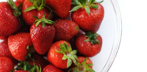 Banner of home strawberry with copy space. Summer vitamin fruits in a bowl.
