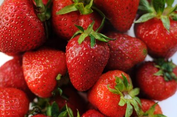 Home strawberry close up background. Summer vitamin fruits in a bowl.