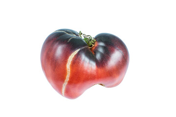 Large red  burgundy cracked tomato in the shape of a heart in white background, isolated. Macro image. Close up.