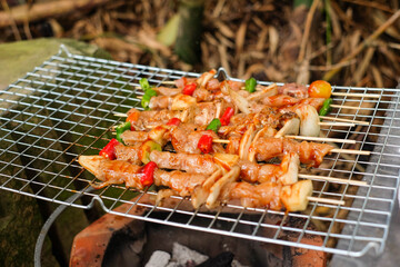 Barbeque is being eaten on a holiday party.
