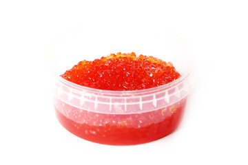 Red caviar in a plastic container on a white background. Caviar storage. Seafood. Expensive food