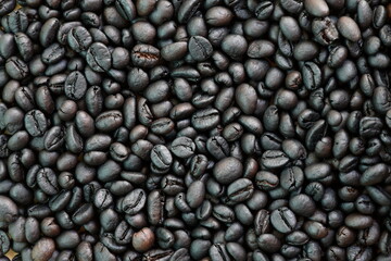 Dark roasted coffee beans background