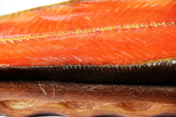 A piece of red fish on a white background. Raw red fish. Seafood