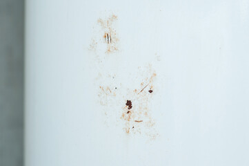 Old wall-mounted boiler rusts after mechanical damage