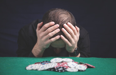 Caucasian sad man in a casino.