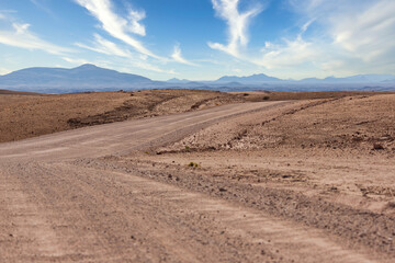 Fototapeta na wymiar Gravel road and beautiful landscape in Namibia