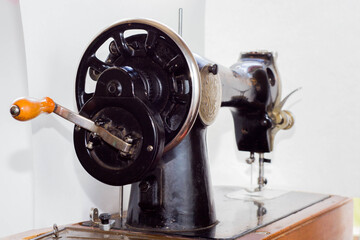old sewing machine at home on a white background