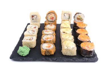 baked sushi in assortment on a stone for serving dishes, white isolated background, horizontal view