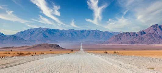 Crédence de cuisine en verre imprimé Bleu Jeans Gravel road and beautiful landscape in Namibia