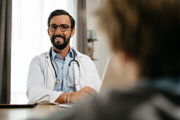 a doctor consults a patient