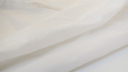 milky colored silk fabric background or texture