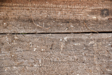 Background of old wooden boards with knots and crevices.