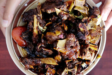 Tengkleng Kambing Pak manto, Solo, Central Java, Indonesia. Traditional Indonesian spicy food made from the bones of goat.