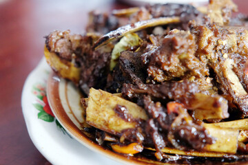 Tengkleng Kambing Pak manto, Solo, Central Java, Indonesia. Traditional Indonesian spicy food made from the bones of goat.