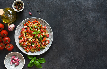 Spicy salad of baked eggplant, peppers and tomatoes. Eggplant caviar. Village ratatouille.