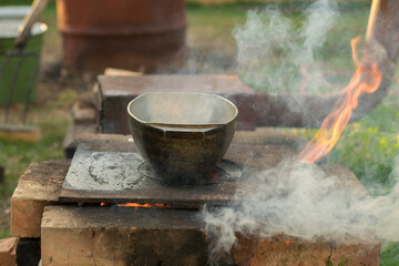 Pilaf in a cauldron with spoon