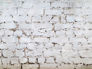 Abstract background old white brick wall with cracks and scratches. Landscape style. Great background or texture.