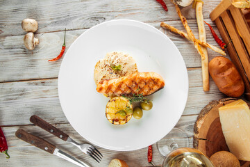 Gourmet dish grilled salmon steak potato gratin