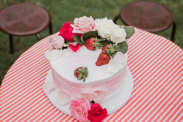 Strawberry birthday cake isolated on table