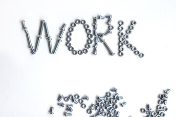 The inscription is the word work lined with bolts and nuts. Bolts and nuts on a white background.