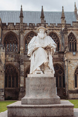 Fototapeta na wymiar Close up of the Statue of Richard Hooker a Writer and theologian, which stands on the green in front of Exeter Cathedral in Devon