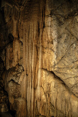 Closeup of a mountain cave with stalactites and stalagmites in Tuscany, Italy, Europe