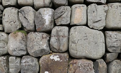 A closeup view of rocks in a dry stone wall.