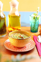 Chicken broth with noodles. Appetizing dish. Suggestion of serving a dish. Culinary photography.