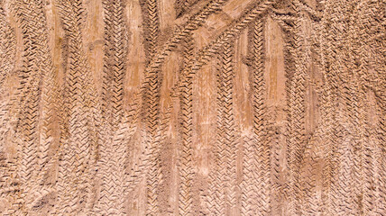 Wheel tracks on dirt Background.