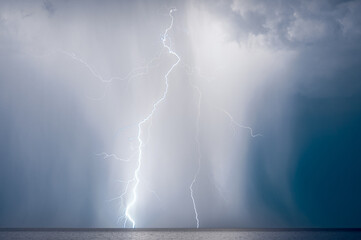 lightning over the sea in the night