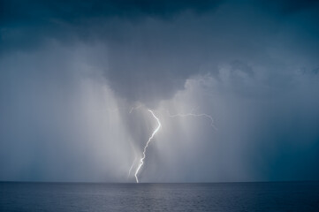 lightning over the sea in the night