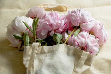Pink peonies lie on the table