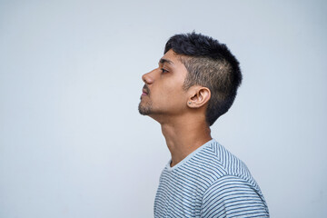 Sensual and Thoughtful. Portrait of handsome shirtless young indian male model being sensual and...