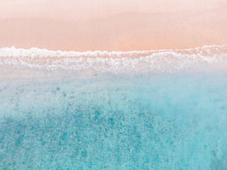 Fototapeta na wymiar Top view on the beach with wave foam